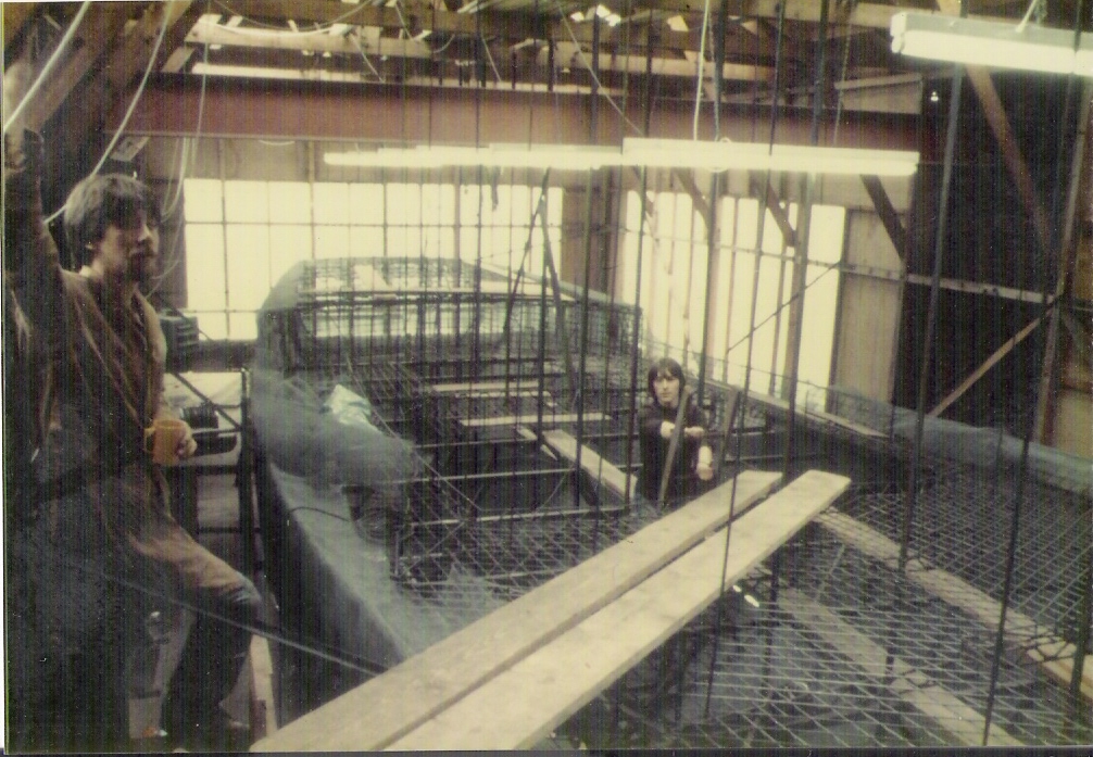 Building armature: making the iron frame of the ferro cement boat and then weaving 10 layers of chicken wire onto it.