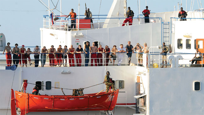 Faina crew and Somali pirates following the ship’s capture in 2008